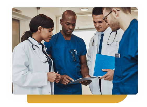 Group of doctors looking at chart